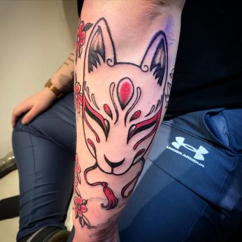 Japanese fox god mask with cherry blossoms - a tattoo by Paul Cooke from Ashton Ink Tattoo Studio - tattooist Oldham