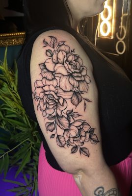 Floral upper arm tattoo done by Symone from Ashton Ink Tattoo Studio - female tattoo artists near me